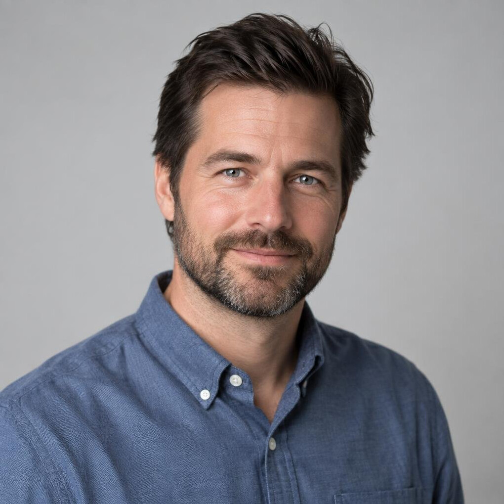 Portrait of a man with dark hair and beard