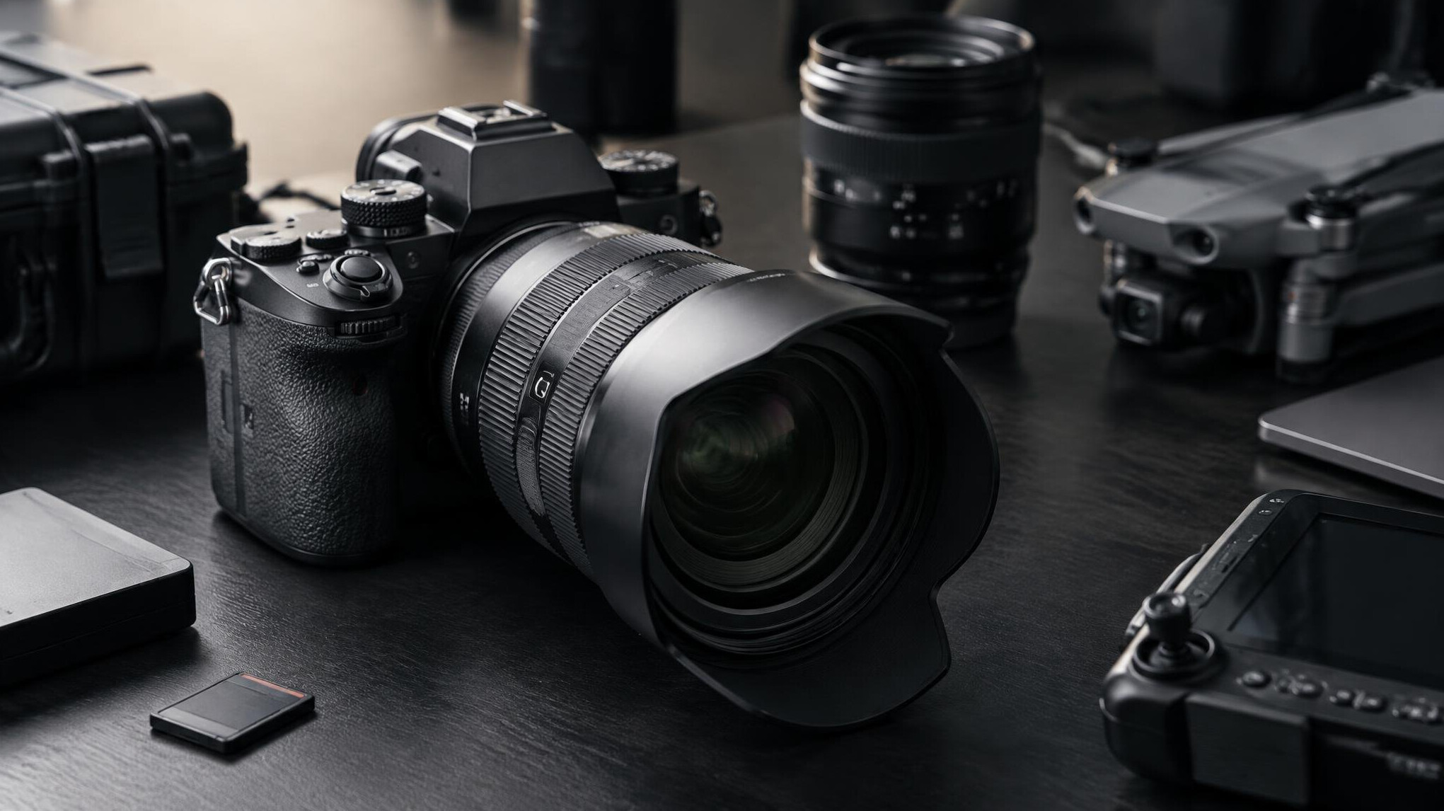 Camera lens close-up on a table with equipment